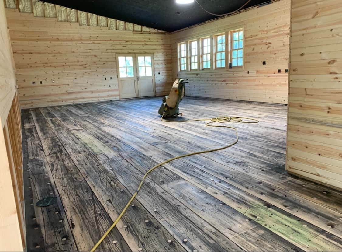Work-in-progress custom wood wall paneling and interior restoration project.
