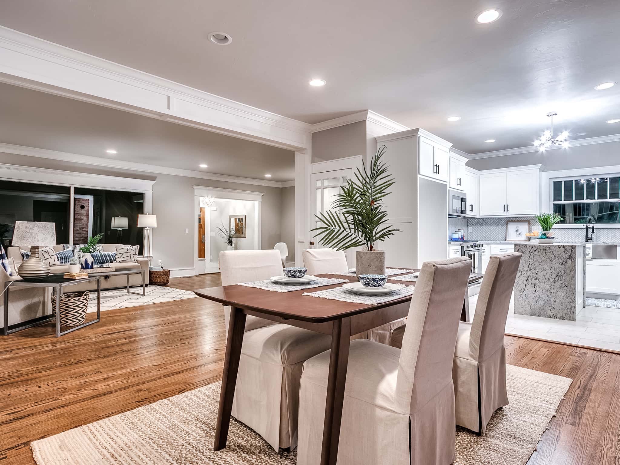 Residential dining room renovation with warm hardwood flooring and modern interior finishes.