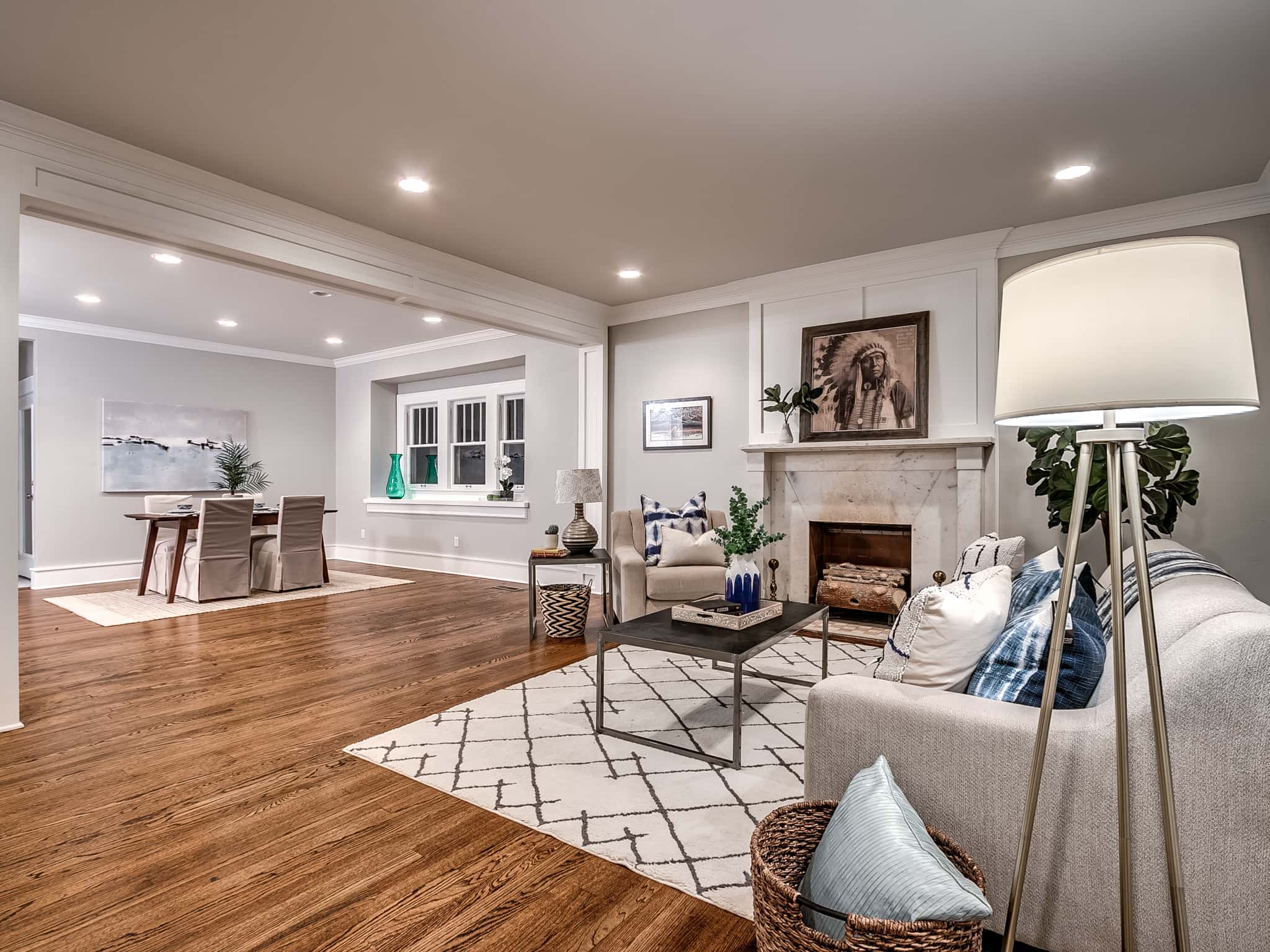 Custom home renovation in Pasadena featuring rich hardwood floors, fireplace mantle, and open layout.